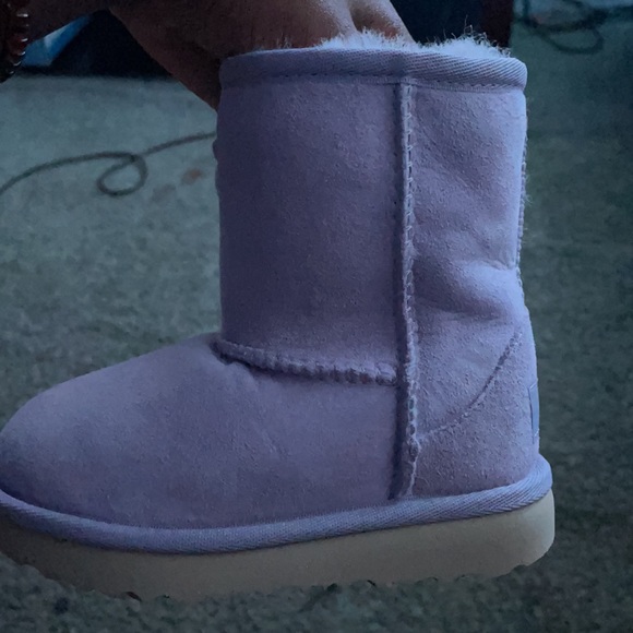 I am selling size 8 ugg boots purple color. Never worn still in the box.